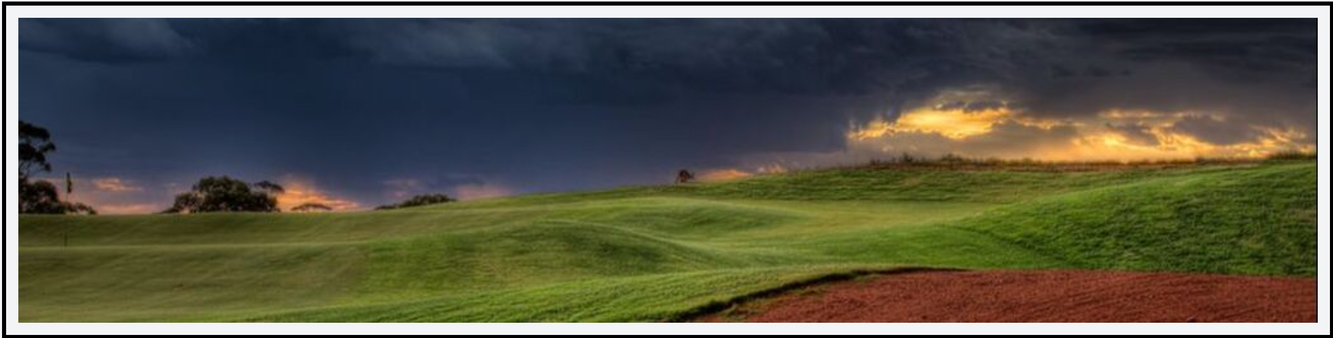 An undulated golf hole with a thick-cut rough and an ominous storm looming ahead.