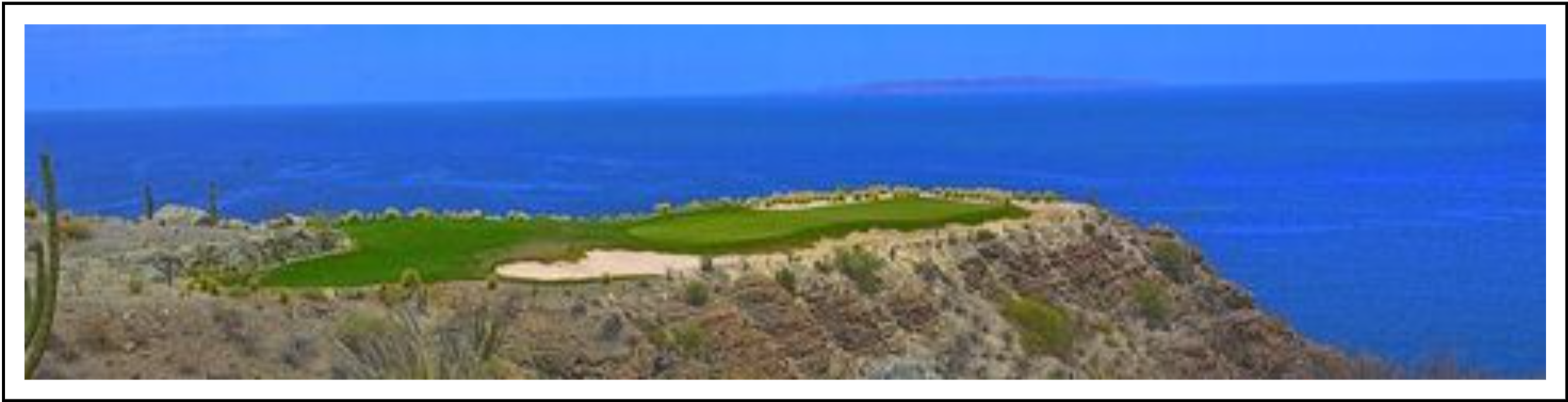 A desert style golf hole over a large chunk of ocean to a small green protected by a bunker.